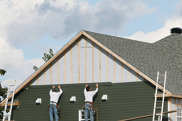 Professional Siding Contractor technician working in Highland, MD